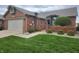 Brick home with well-maintained lawn featuring an attached two-car garage at 1330 Country Creek Cir, Shelbyville, IN 46176