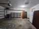 Spacious garage with shelving units and additional storage cabinets at 1330 Country Creek Cir, Shelbyville, IN 46176