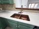 Close-up of the kitchen sink with dual basin and white countertop at 1330 Country Creek Cir, Shelbyville, IN 46176