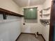 Bright laundry room with storage cabinets and hanging rack at 1330 Country Creek Cir, Shelbyville, IN 46176