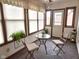 Sunroom featuring natural light, tile flooring, and patio furniture, creating a cozy atmosphere at 1330 Country Creek Cir, Shelbyville, IN 46176