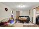 Comfortable living room with hard wood flooring and neutral colored walls at 13346 N Miller Dr, Camby, IN 46113