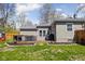 Landscaped backyard with a deck, grass area, and manicured flower beds at 1355 E 56Th St, Indianapolis, IN 46220