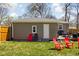 Back of home featuring a well-maintained lawn, chairs and a deck for relaxing at 1355 E 56Th St, Indianapolis, IN 46220