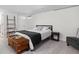 Cozy basement bedroom with neutral carpet, side tables, and room to relax at 1355 E 56Th St, Indianapolis, IN 46220