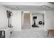 View of the finished basement stairs leading to a versatile area for fitness or storage at 1355 E 56Th St, Indianapolis, IN 46220