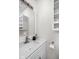 Bright bathroom featuring a white vanity with updated fixtures and a framed mirror at 1355 E 56Th St, Indianapolis, IN 46220