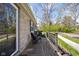 Inviting wood deck with outdoor seating, offering a relaxing space adjacent to the stone home at 1355 E 56Th St, Indianapolis, IN 46220