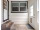 Covered entryway with slate tile flooring and a storm door entrance at 1355 E 56Th St, Indianapolis, IN 46220