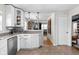 Well-lit kitchen showcasing stainless steel appliances and views into the living room at 1355 E 56Th St, Indianapolis, IN 46220