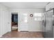 Bright kitchen showcasing a stainless steel refrigerator and access to another room at 1355 E 56Th St, Indianapolis, IN 46220