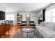 Open-concept living room with a view of the dining area and front door at 1355 E 56Th St, Indianapolis, IN 46220