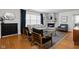 Sunlit living room with a stone fireplace, hardwood floors, and stylish furniture at 1355 E 56Th St, Indianapolis, IN 46220