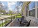 Cozy covered porch with chairs and table, perfect for enjoying the neighborhood views at 1355 E 56Th St, Indianapolis, IN 46220