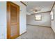 Finished basement area with carpet, windows, and ceiling fan at 1503 Saint John S Ct, Beech Grove, IN 46107