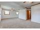 Spacious finished basement with carpet, windows, and doorway to stairwell at 1503 Saint John S Ct, Beech Grove, IN 46107