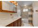Neutral bathroom featuring a vanity, a tub and shower with a curtain and natural light from the window at 1503 Saint John S Ct, Beech Grove, IN 46107