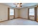 Spacious bedroom features neutral carpet, ceiling fan, and two windows creating a bright atmosphere at 1503 Saint John S Ct, Beech Grove, IN 46107