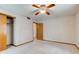 Bedroom with neutral carpet and walls, a closet and ceiling fan to keep the space cool and comfortable at 1503 Saint John S Ct, Beech Grove, IN 46107
