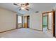 Spacious bedroom with neutral walls, ceiling fan and window with closet for organized storage at 1503 Saint John S Ct, Beech Grove, IN 46107