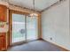 Cozy dining area with a decorative light fixture and sliding glass doors leading to the backyard at 1503 Saint John S Ct, Beech Grove, IN 46107