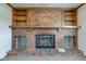Close-up of a decorative brick fireplace with built-in shelves at 1503 Saint John S Ct, Beech Grove, IN 46107