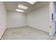 Spacious garage with ample room for parking and storage and featuring overhead lighting at 1503 Saint John S Ct, Beech Grove, IN 46107