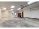 Large garage with overhead door, an abundance of natural light and space for cars and storage at 1503 Saint John S Ct, Beech Grove, IN 46107