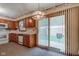 Functional kitchen featuring wooden cabinets and a sliding glass door that allows ample natural light at 1503 Saint John S Ct, Beech Grove, IN 46107
