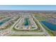 Aerial of a neighborhood showcasing community layout, pond, and proximity to main roads at 15150 Mooring E Cir, Carmel, IN 46033