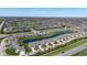 Aerial of community highlighting pond, landscaping, and the overall neighborhood layout at 15150 Mooring E Cir, Carmel, IN 46033