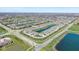 Aerial shot of neighborhood with ponds and Bridgewater Golf Club in the distance at 15150 Mooring E Cir, Carmel, IN 46033