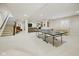 Spacious finished basement featuring a ping pong table and seating area with stairs at 15150 Mooring E Cir, Carmel, IN 46033