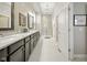 Bright bathroom featuring double vanity with granite counters and a glass enclosed shower at 15150 Mooring E Cir, Carmel, IN 46033