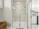 Bright bathroom with a walk-in shower with glass doors and a built-in bench at 15150 Mooring E Cir, Carmel, IN 46033