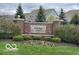Community entrance sign with brick pillars and manicured landscaping, welcoming residents and guests at 15150 Mooring E Cir, Carmel, IN 46033
