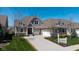 Charming home with a two-car garage, landscaped yard, and a concrete driveway at 15150 Mooring E Cir, Carmel, IN 46033