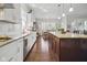 Well-lit kitchen featuring granite counters, an island with seating, and stainless steel appliances at 15150 Mooring E Cir, Carmel, IN 46033