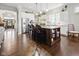 Modern kitchen with stainless steel appliances, a center island, and dark wood flooring at 15150 Mooring E Cir, Carmel, IN 46033