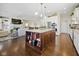 Open-concept kitchen showcasing a center island, stainless appliances, and access to the living room at 15150 Mooring E Cir, Carmel, IN 46033