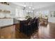 Bright kitchen featuring granite countertops, white cabinets, an island, and a breakfast nook at 15150 Mooring E Cir, Carmel, IN 46033