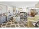 Spacious living room with elegant furniture and open access to the kitchen and dining area at 15150 Mooring E Cir, Carmel, IN 46033