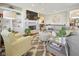 Cozy living room featuring a fireplace, built-in shelving, and neutral decor at 15150 Mooring E Cir, Carmel, IN 46033