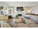 Bright living room features a fireplace, built-in shelving, and comfortable seating at 15150 Mooring E Cir, Carmel, IN 46033