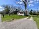 Exterior view of the property with its well-maintained lawn and surrounding greenery at 1710 Stevenson St, Indianapolis, IN 46228