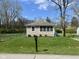 Charming single story home boasting a well-manicured lawn and curb appeal at 1710 Stevenson St, Indianapolis, IN 46228