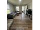 Bright living room featuring new laminate flooring and neutral paint at 1710 Stevenson St, Indianapolis, IN 46228