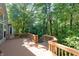 This back deck is a peaceful space surrounded by lush greenery at 1770 Valleywood Dr, Avon, IN 46123
