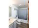 Bright bathroom with a vanity, tile floor, and shower-tub combo at 1770 Valleywood Dr, Avon, IN 46123