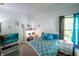 Comfortable bedroom featuring a desk, natural light, and a coordinated decor scheme for a relaxing ambiance at 1770 Valleywood Dr, Avon, IN 46123